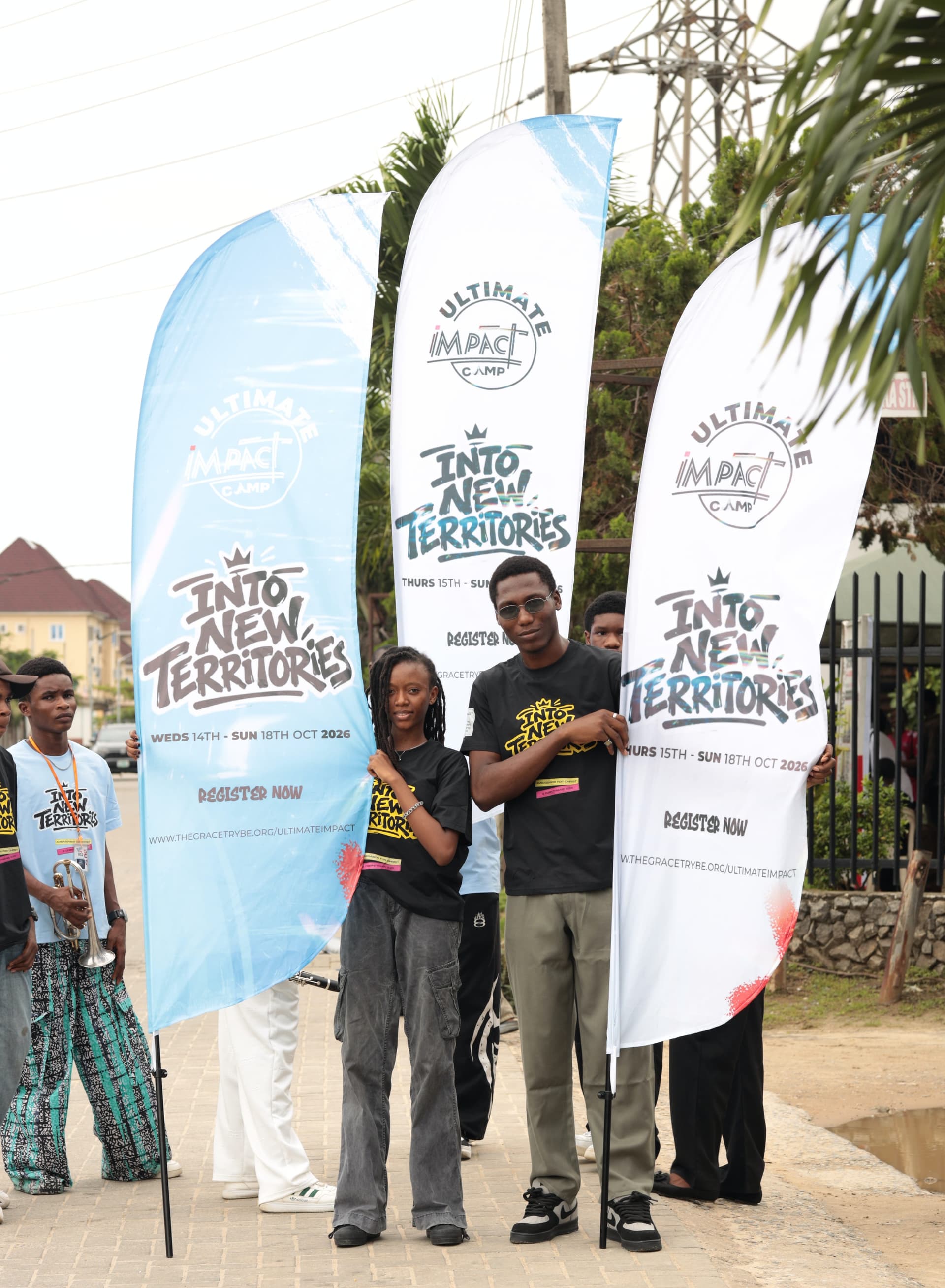 Young adults gathered outdoors in community